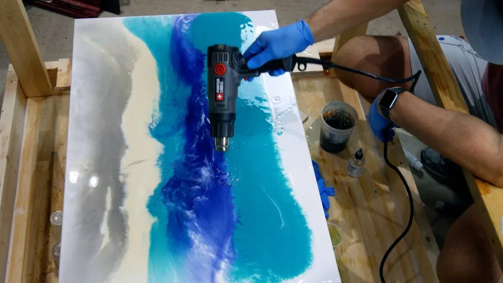 blend resin art on canvas with heat gun