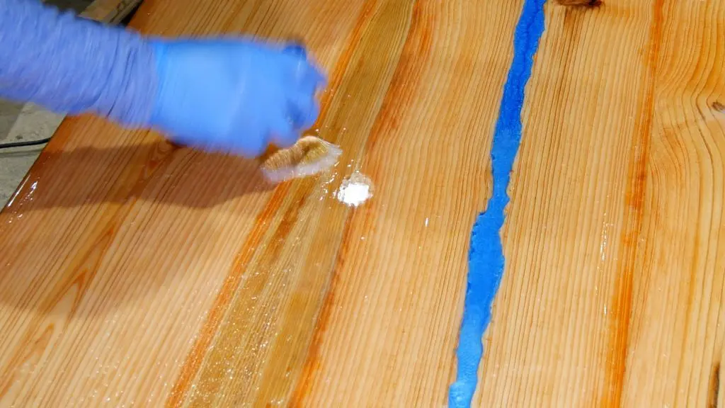 how to make a rustic table with epoxy resin - flood coat chop brush
