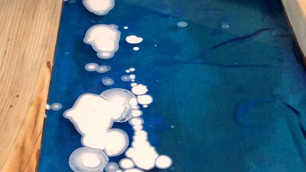 Adding alcohol ink to resin ocean wave art