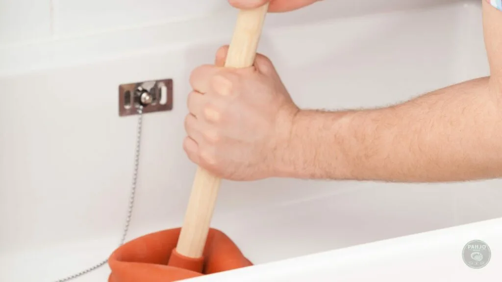 unclog bathtub drain with standing water